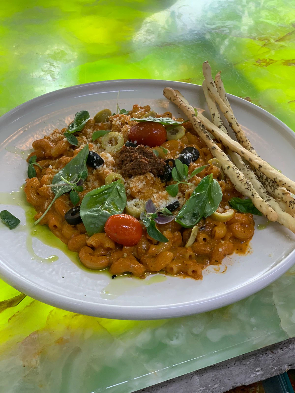 Pasta in tomato sauce served with grilled bread