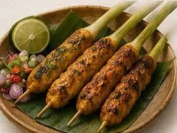 Balinese sate lilit, minced chicken and coconut skewers on lemongrass
